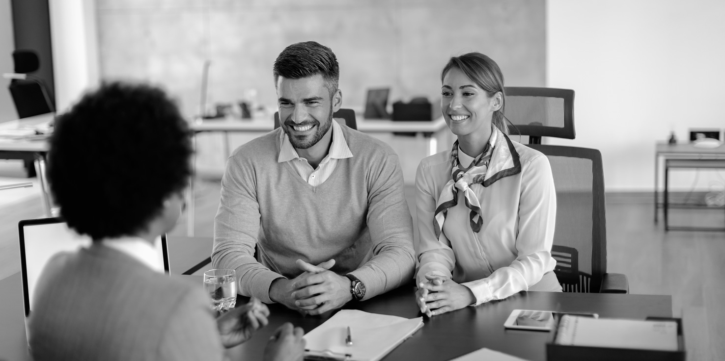 Couple discussing finances with Logic Partners