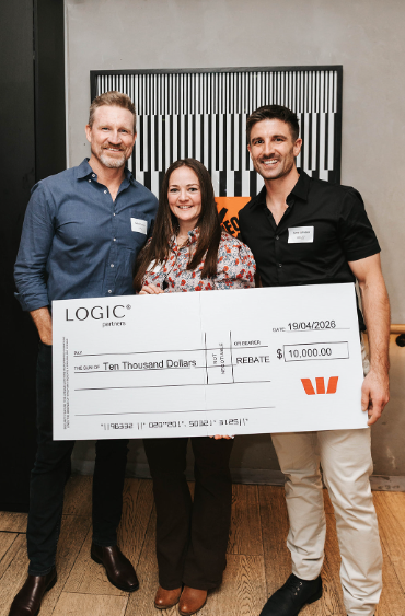 Jamie and Bec, Logic Partners clients, with their $10,000 rebate cheque